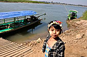 Myanmar - Inwa, Innwa girl wearing traditional makeup (Thanaka) 